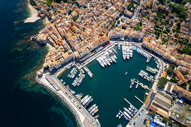 Aerial view of Saint Tropez with Mega Yachts and Sail boats getting ready for racing on Regatta Day