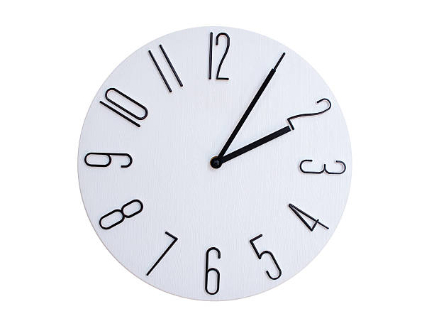 Minimalist Round Wall Clock Showing 02:05 or 14:05. Thin Black Numerals on White Wood Background.
