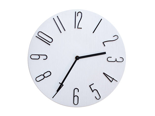 Minimalist Round Wall Clock Showing 02:35 or 14:35. Thin Black Numerals on White Wood Background.