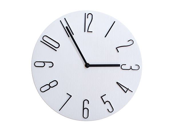 Minimalist Round Wall Clock Showing 02:55 or 14:55. Thin Black Numerals on White Wood Background.