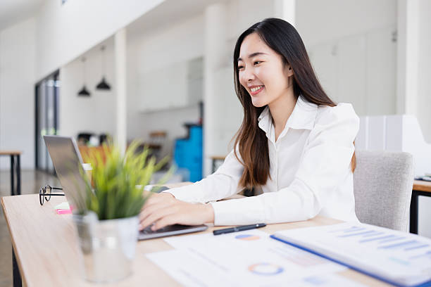 istock Asian businesswoman analysis data at desk in office working space. 2214521580