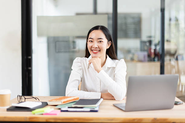 istock Asian businesswoman analysis data at desk in office working space. 2214521675