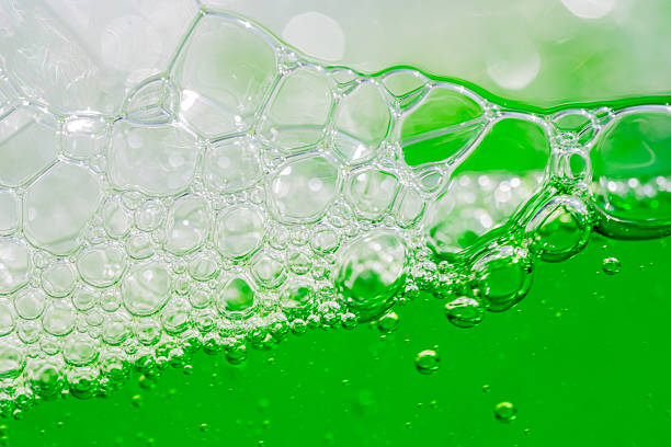 istock Water wave, close up of vibrant green liquid with bubbles, capturing dynamic movement and freshness. Perfect for backgrounds, beverages, or abstract concepts. soft drink 2214522182