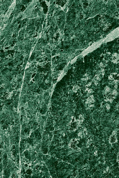 istock Real closeup of dark green marble stone texture surface background. Design pattern with high resolution for luxury home decoration. Abstract matt slab rock material. Front view of natural tiles stone surface. 2214523992