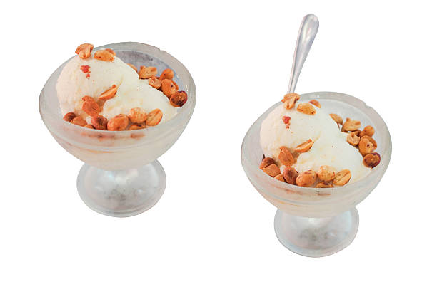 Traditional Thai Coconut Ice Cream with Roasted Peanuts. Isolated on White