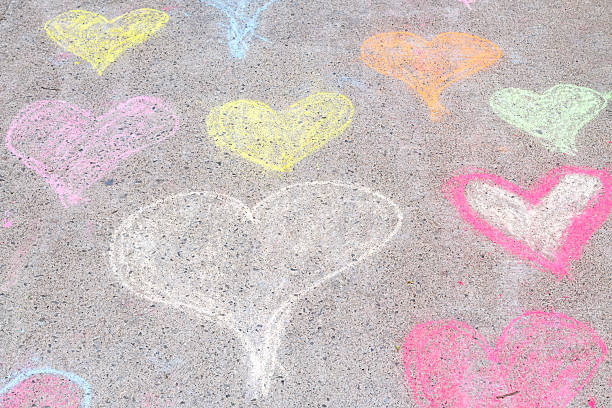 Red heart symbol. Grungy wall background. Fall in love and Valentine's day concept.