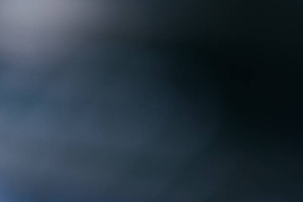 Blue background created in camera with a macro lens with overlapping bokeh circular shapes soft edges light and dark areas with room for copy and text.