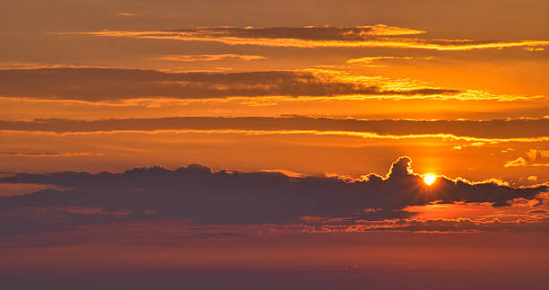 istock Orange sunrise with dark clouds, England, Britain 2214530176