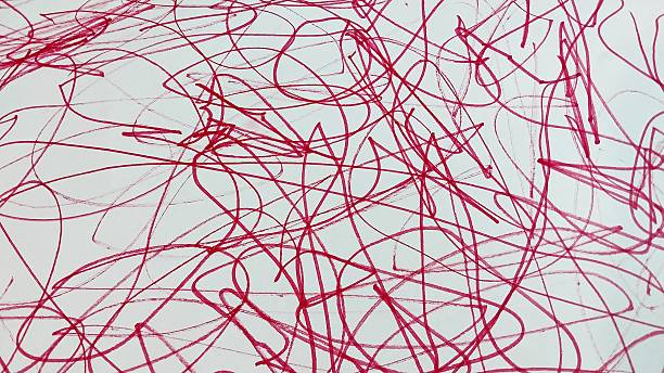 istock Abstract red scribbles and swirls on a white background, creating a chaotic and dynamic artistic pattern. 2214530343