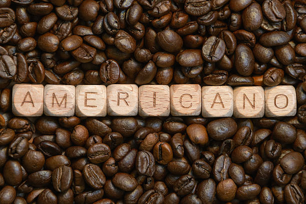 istock Americano blocks on coffee bean background highlighting coffee culture 2214533001