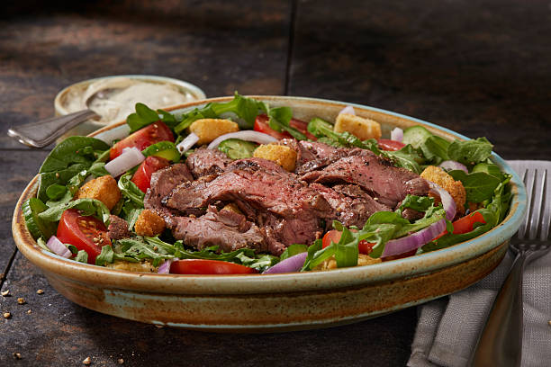 istock Succulent Medium Rare Flank Steak Salad 2214544035
