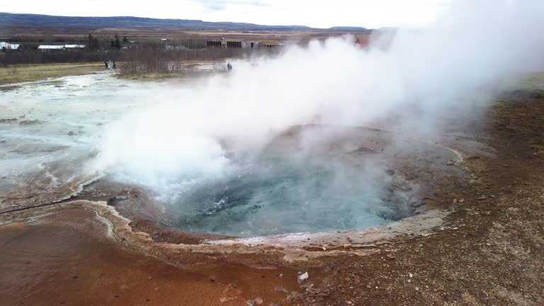 Hot spring pool Geysir in Iceland boiling and waiting to erupt