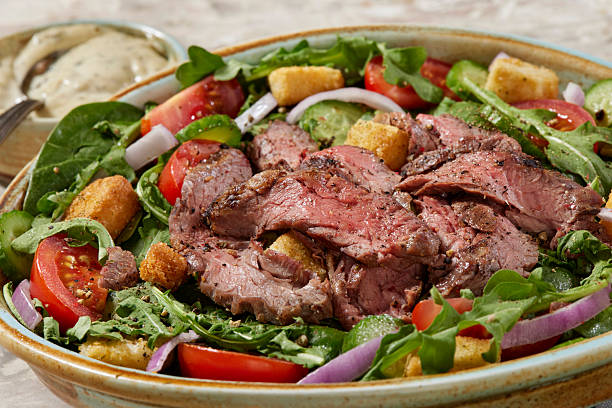istock Succulent Medium Rare Flank Steak Salad 2214544631