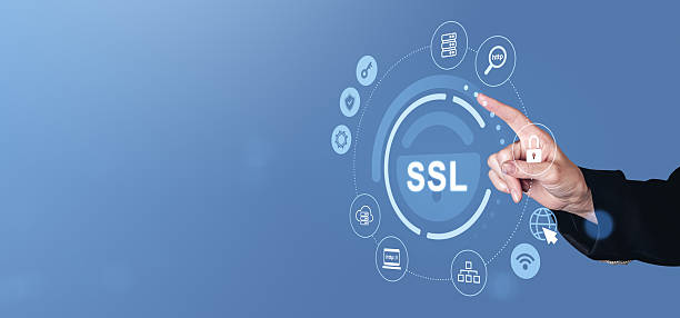 istock SSL security concept with hand pointing to digital lock icon on blue background. 2214547715