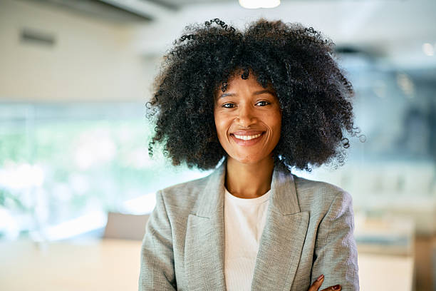 istock Confident young businesswoman smiling in modern office 2214551265