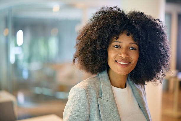 istock Confident businesswoman smiling in modern office space 2214551291