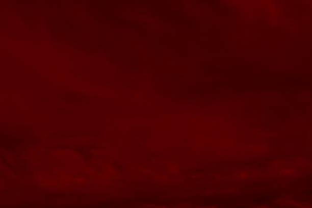 istock Red cloud texture background. Blurred photo of red sky with clouds. 2214552389