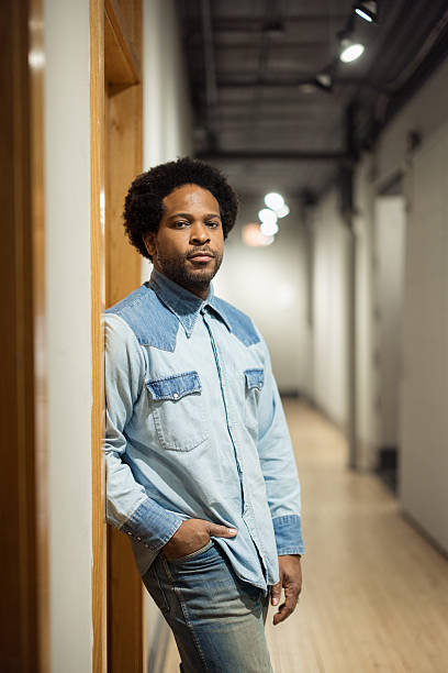 istock Confident artist standing in a hallway 2214554094