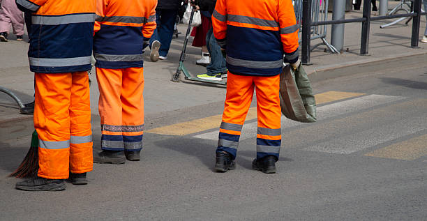 istock Communal service workers are engaged in garbage collection in the city. 2214558566