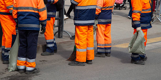 istock Communal service workers are engaged in garbage collection in the city. 2214558572