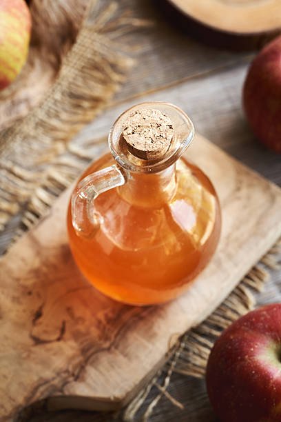 istock Apple cider vinegar in a glass jug 2214560633