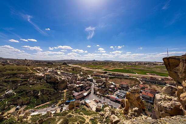 Cappadocia is a historical region in Central Anatolia, Turkey, known for its unique landscape, underground cities, cave dwellings, and fairy chimneys. The region is characterized by its surreal rock formations, carved out over centuries by wind and water erosion. These formations, known as fairy chimneys, create a stunning backdrop for hot air balloon rides at sunrise. Cappadocia is also famous for its ancient Christian churches, some of which are adorned with intricate frescoes.