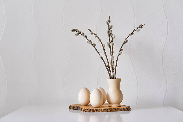 istock Natural Easter Still Life with Wooden Eggs and Willow Twigs 2214566557