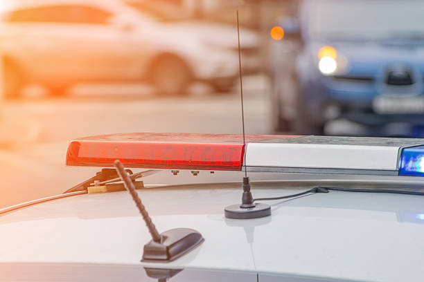 istock working red blue flashing light on police car. emergency service 2214568679