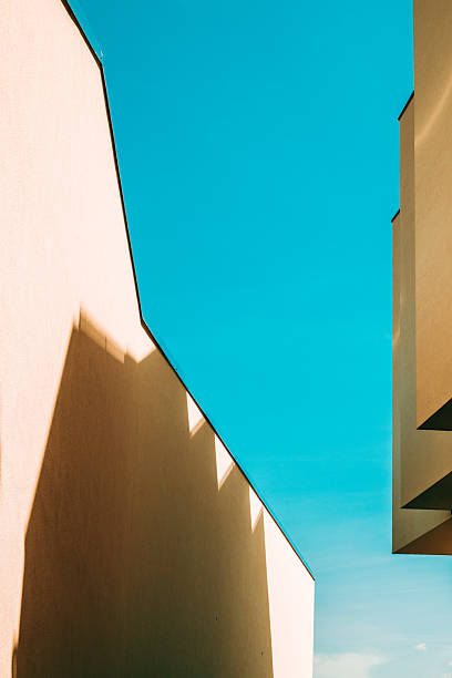 istock Architectural pattern, modern residential building facade with shadow and light, minimalistic composition 2214572265