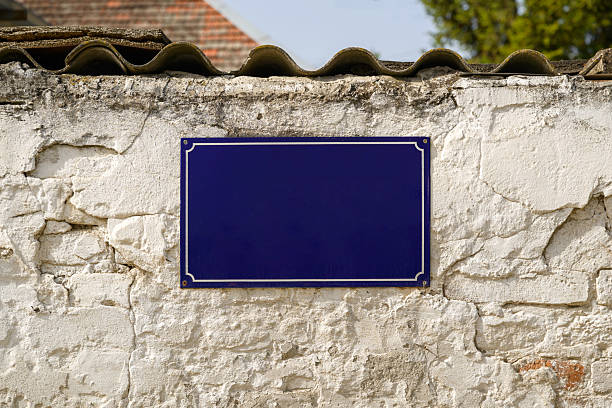 Empty street name plate mock up on old brick wall