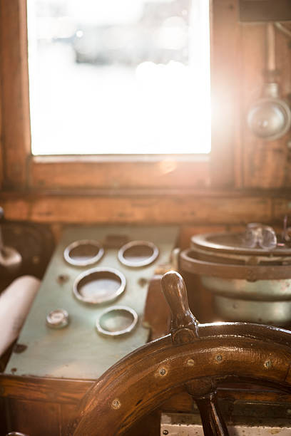 istock Vintage wooden ship steering wheel.. 2214573592