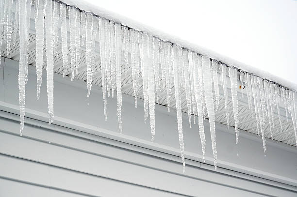 istock icicle hanging on the house roof 2214574595