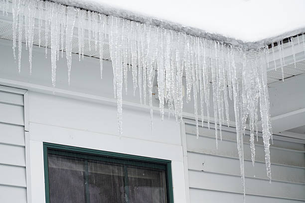 istock icicle hanging on the house roof 2214574604