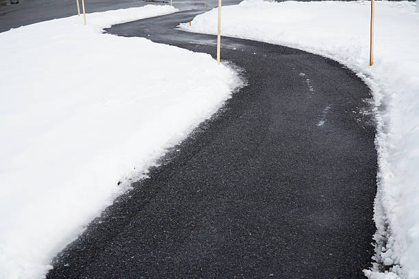 istock winding sidewalk after snow with snow removed 2214574695