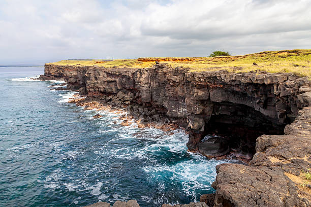 Coastal Cliffs and Cave at Ka Lae, Big Island, Hawaii on a Sunny Day