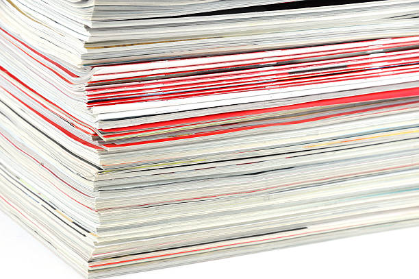 istock close up on stacking magazines isolated on white background 2214576601