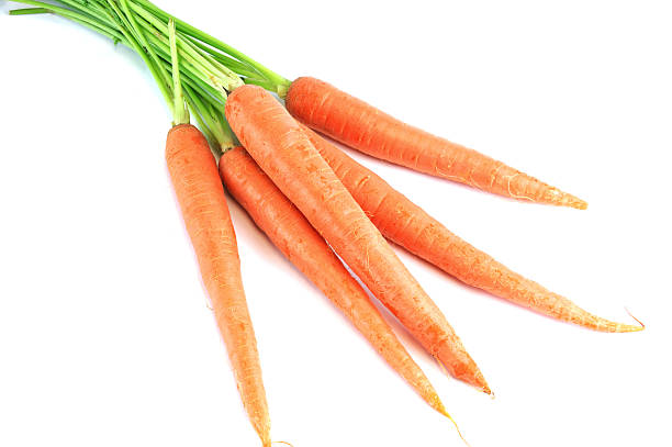 istock fresh carrot with leaves isolated on white background 2214576624