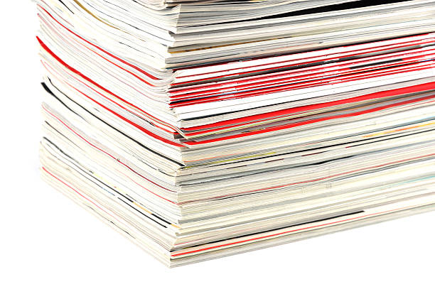 istock close up on stacking magazines isolated on white background 2214577264