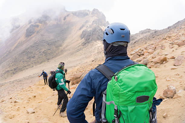 Group of hikers ascending iztaccihuatl volcano in mexico