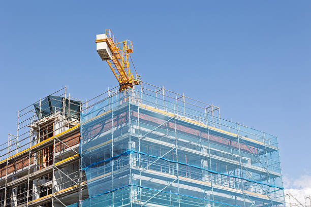 istock Construction crane building new skyscraper on a sunny day 2214579319