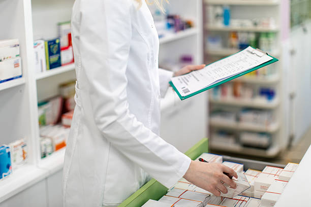 istock Young woman pharmacist at her workplace 2214586647