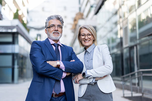 istock Two professionals displaying teamwork in bright city 2214594651
