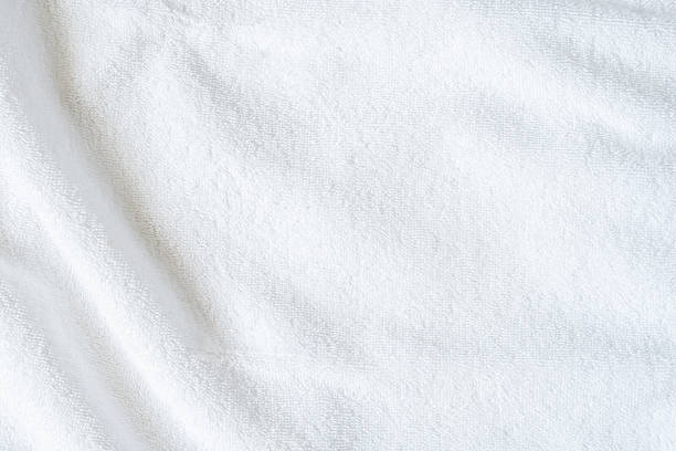 istock White towel texture background or beach bath fabric, kitchen wiper towel or plain blank cloth bathroom rug made of soft clean cotton fiber material for linen laundry backdrop 2214594748