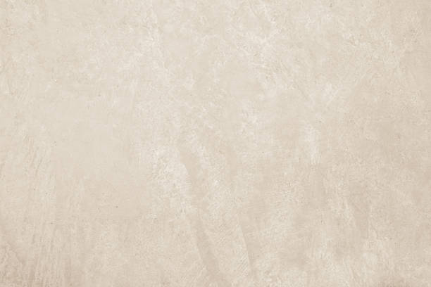 istock Colour old concrete wall texture background. Close up retro plain cream color cement wall background texture. Design paper vintage parchment element. 2214594899