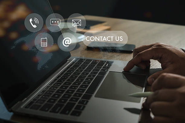 istock Contact us concept, hand using laptop with communication icons, digital marketing 2214595200