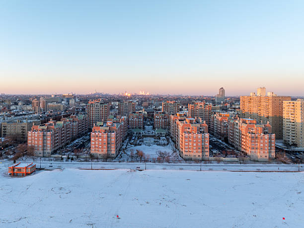 Aerial view of a snow covered Coney Island Beach during the winter at sunset in Brooklyn, New York
