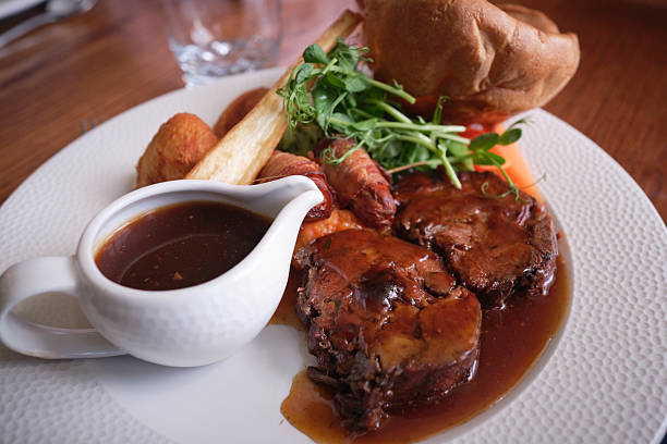 Traditional British Sunday Lunch, roast beef, gravy and Yorkshire pudding.