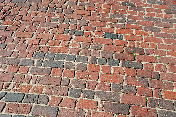 Cobblestone road, black and white, abstract background with copy space, full frame horizontal composition