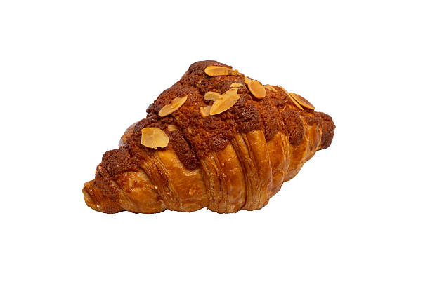istock A flaky almond croissant, generously topped with sliced almonds, rests on a white background, showcasing its rich, golden-brown crust. 2214606699