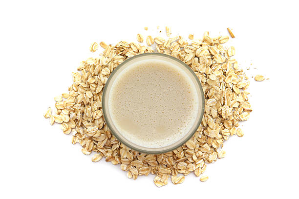 oat milk in a glass isolated on a white background